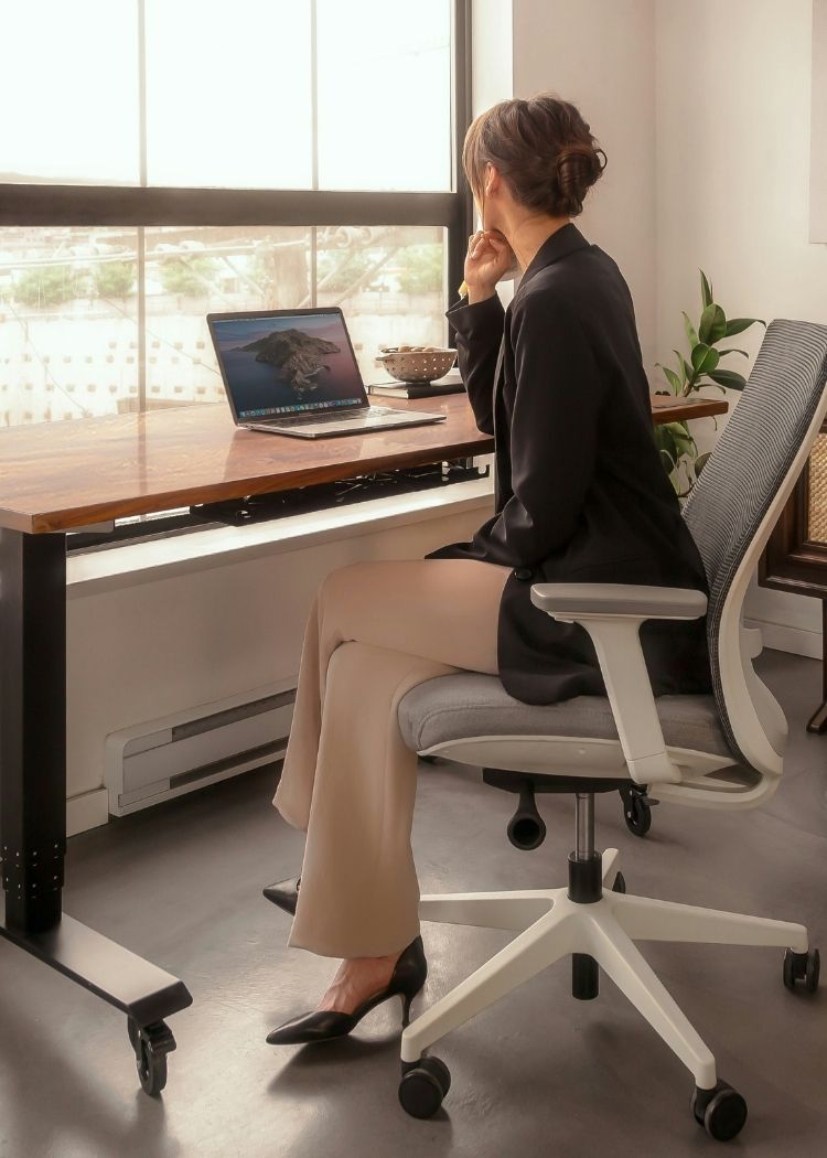 woman writing in a weekly planner
